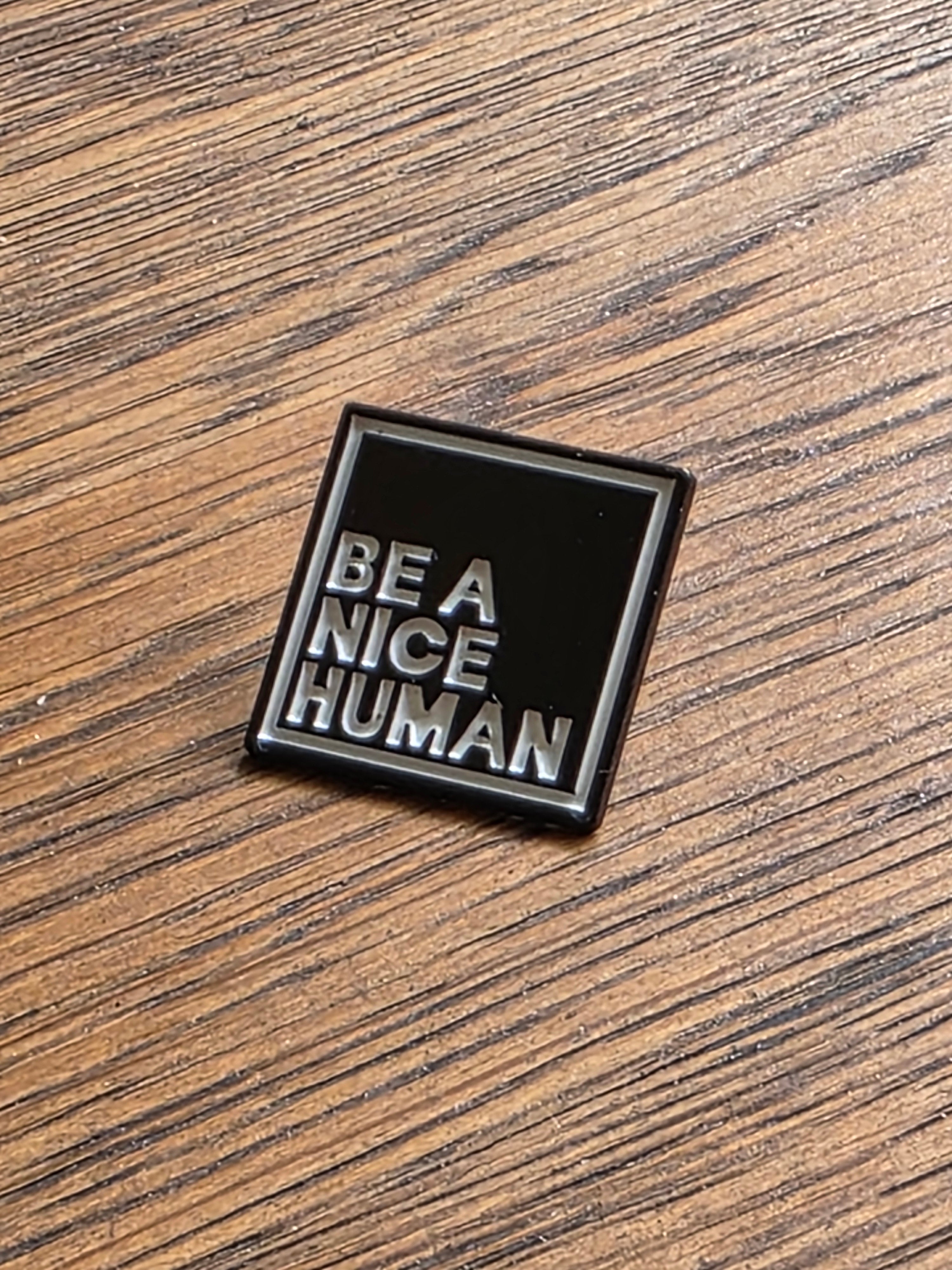 Be a Nice Human - Black pin badge